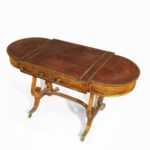 A Regency period rosewood sofa games table attributed to Gillows of Lancaster top