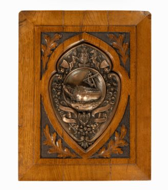 An H.M.S. Foudroyant copper shield,