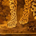 An Art Deco marquetry panel of a jaguar close up