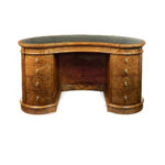 A Victorian kidney shaped desk in richly figured burr walnut, attributed to Gillows