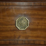 A George III mahogany serpentine chest of drawers handle