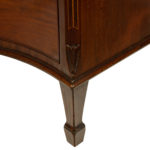 A George III mahogany serpentine chest of drawers leg corner