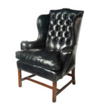 A generous George III wing arm chair,