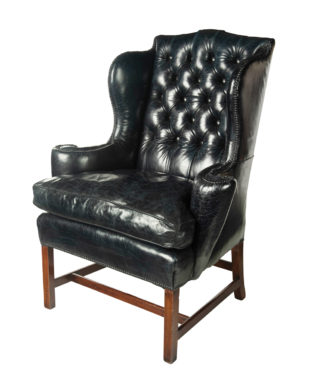 A generous George III wing arm chair,