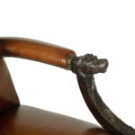 A large pair of Irish mahogany library armchairs in the Georgian style arm