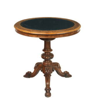 A Victorian walnut revolving display table,