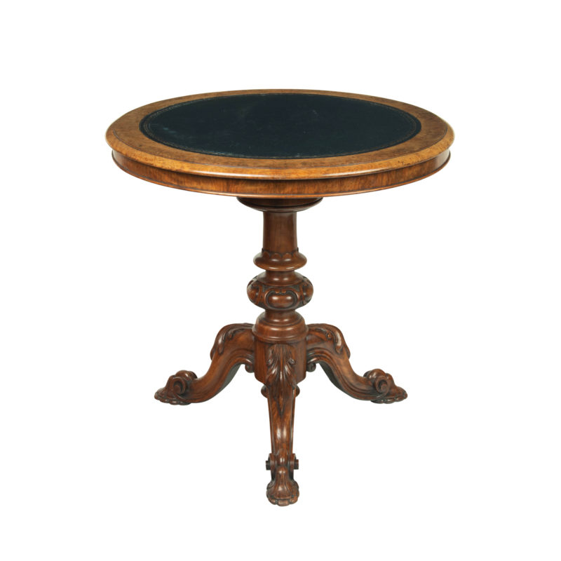A Victorian walnut revolving display table,