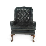 A large George III wing arm chair front on