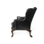 A large George III wing arm chair side