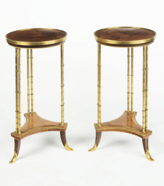 A pair of Louis XVI style mahogany and ormolu gueridons, after Adam Weisweiler
