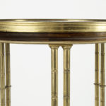 A pair of Louis XVI style mahogany and ormolu gueridons top detail