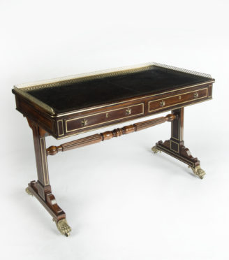 A Regency rosewood free standing end support writing table, by Gillows,