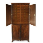 A late George III mahogany collector’s cabinet top open