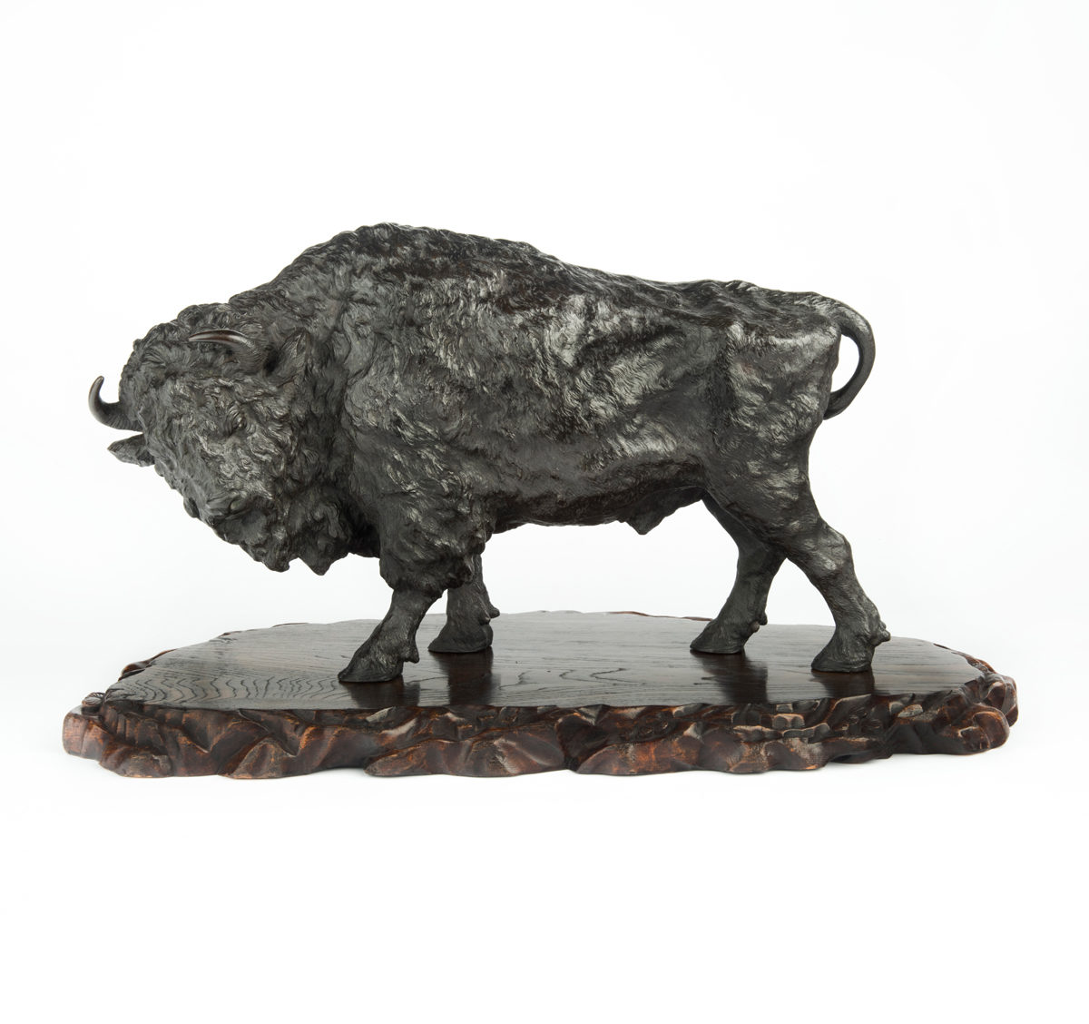 A large and impressive Meiji period bronze bison by Sano Takachika for the Kakuha Company