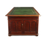 A large and imposing Victorian mahogany partners' desk side