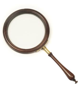 A George III gallery magnifying glass, the circular glass within a mahogany frame