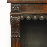 A late Regency rosewood breakfront open bookcase corner details
