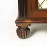 A late Regency rosewood breakfront four door side cabinet, attributed to Gillows foot