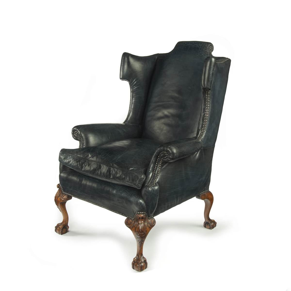 A generous late Victorian walnut wing arm chair, in the Georgian style