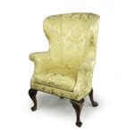 An elegant George I walnut wing armchair,
