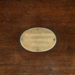 A mahogany strong box plaque