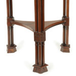 A pair of mahogany circular occasional tables detail legs