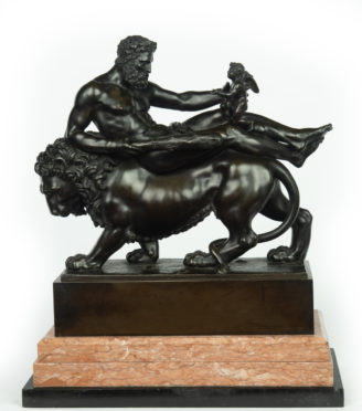 A bronze group of Hercules and Cupid