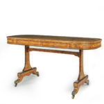 A Regency figured pollard oak end support writing table from Asprey & Co Ltd