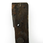 This solid piece of oak with traces of white and yellow paint is part of the anchor windlass mechanism.