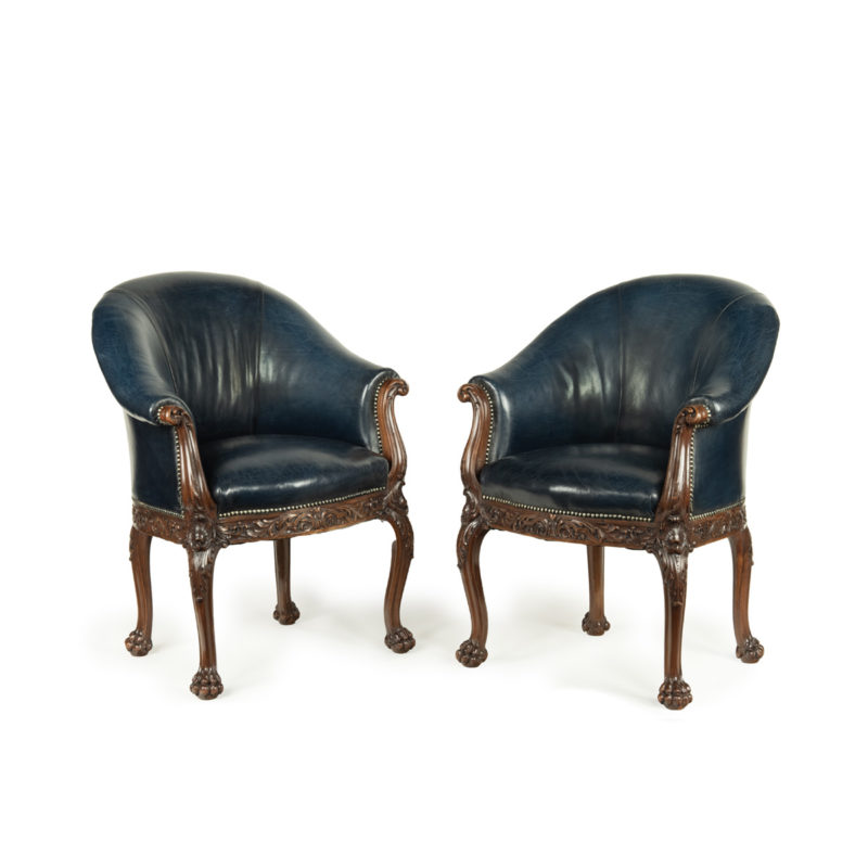 A pair of Victorian blue leather and walnut tub chairs