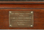 An oak stool from the timber of H.M.S. Britannia plaque