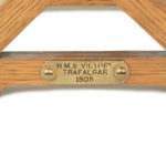 An oak spirit barrel made from H.M.S. Victory timber detail plaque