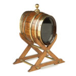 An oak spirit barrel made from H.M.S. Victory timber on stand