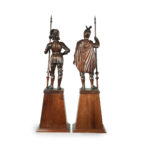 A pair of carved walnut mediaeval knights back