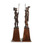 A pair of carved walnut mediaeval knights side