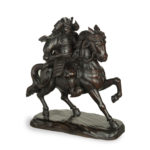 A powerful Japanese equestrian wood carving of a samurai by Yoshida Issen/Isshun