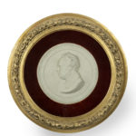 A framed plaster portrait plaque of the Glasgow Reformist MP James Oswald, signed and dated Carlo Marochetti, 1842, of circular form, shown facing to the right within a black border and the original glazed giltwood frame.