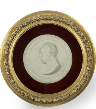 A framed plaster portrait plaque of the Glasgow Reformist MP James Oswald, signed and dated Carlo Marochetti, 1842, of circular form, shown facing to the right within a black border and the original glazed giltwood frame.