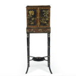 A delicate Regency Chinoiserie lacquer cabinet,