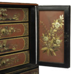 A delicate Regency Chinoiserie lacquer cabinet details door