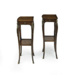 A pair of George III marquetry tables in the French taste sides
