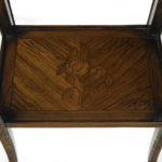 A pair of George III marquetry tables in the French taste detail