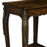 A pair of George III marquetry tables in the French taste detail leg corner