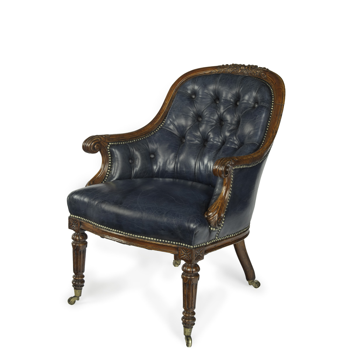 A Victorian blue leather oak library chair