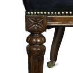 A Victorian blue leather oak library chair legs
