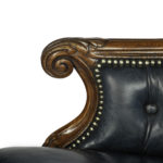 A Victorian blue leather oak library chair arm