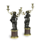 A pair of Egyptian porphyry and bronze candelabra after Charles-Antoine Bridan Back