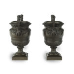 A pair of Belgian bronze urns by Luppens side