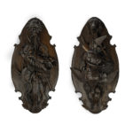 A very fine pair of ‘Black Forest’ walnut game plaques,