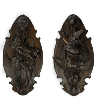 A very fine pair of ‘Black Forest’ walnut game plaques,